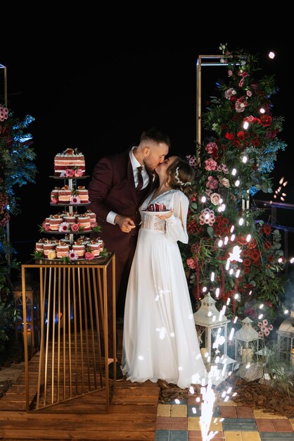 Newlyweds happily cut laugh and taste the wedding cake