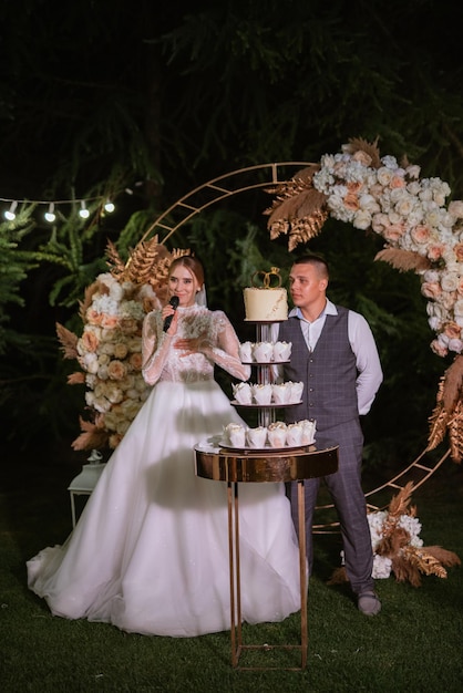 Newlyweds happily cut and taste the wedding cake