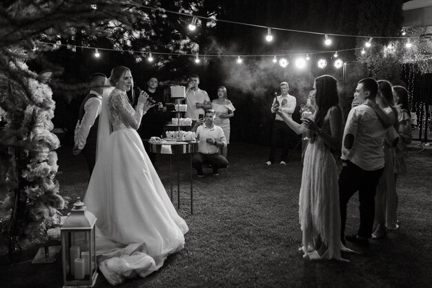 Newlyweds happily cut and taste the wedding cake