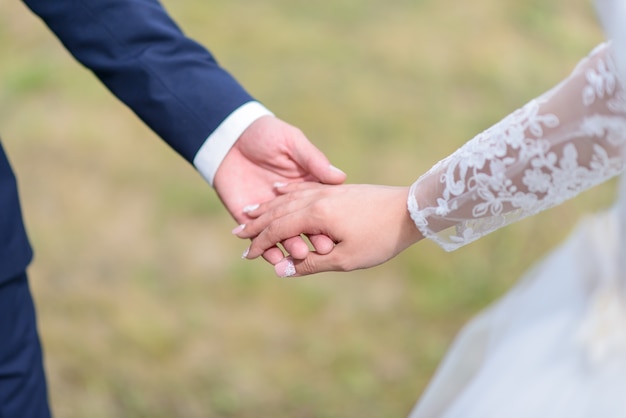 Newlyweds holding hands