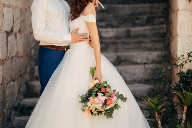 Newlyweds hug each other in montenegro