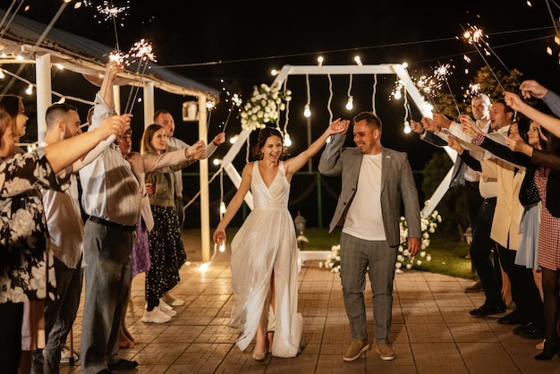 Newlyweds at a wedding of sparklers