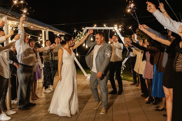 Newlyweds at a wedding of sparklers