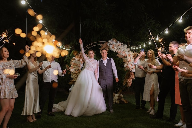 Newlyweds at a wedding of sparklers