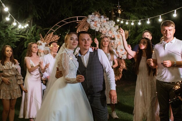 Newlyweds at a wedding of sparklers