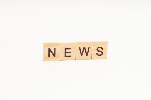 NEWS words on wooden blocks isolated