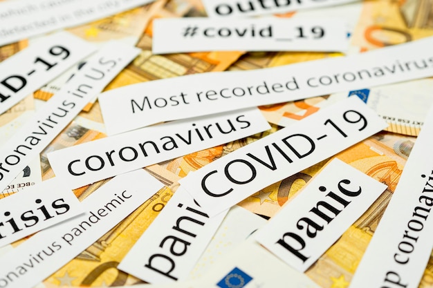 Photo newspaper coronavirus titles on money