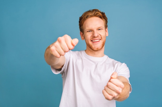 nice attractive confident cheerful man wearing casual holding in hands driving invisible car