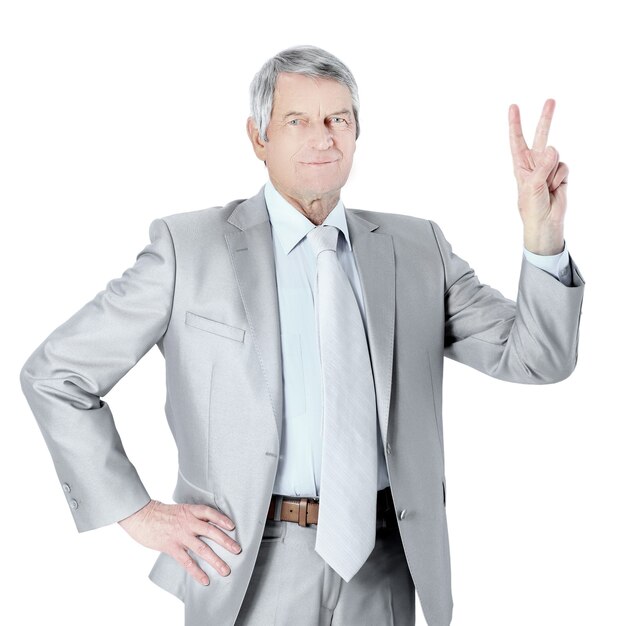 Nice businessman at the age welcoming  isolated on a white background