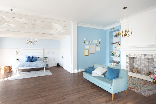 Nice cozy interior of a spacious room in gentle blue tones