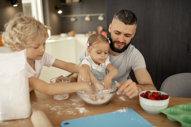 Nice cute small children helping their father