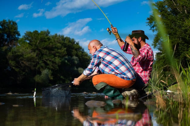 Nice day for fishing bearded men catching fish off limits fishing fishermen fishing equipment fisher