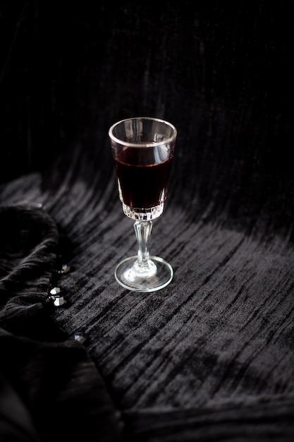 Nice glass of red wine on a black background Velvet