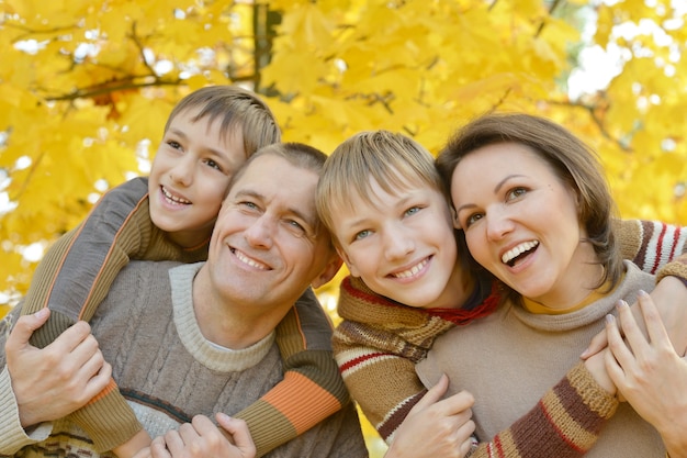 Nice happy family relax in the autumn park