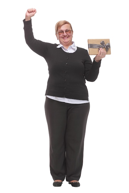 Nice happy woman pointing up with her finger while holding a present box