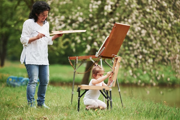 Nice job. Teaching granddaughter how to paint. In the natural parkland