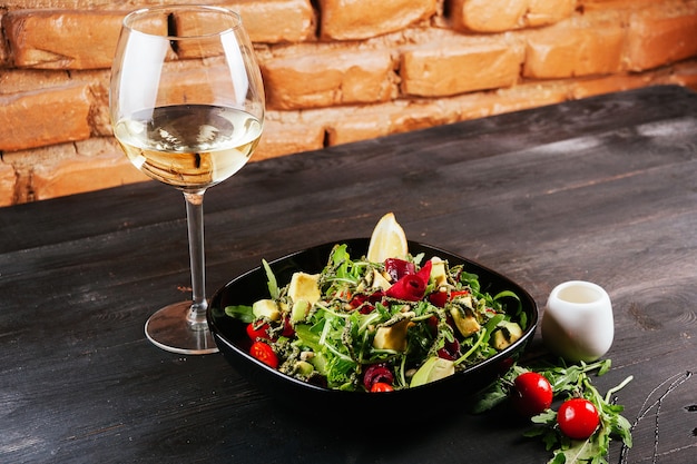 Nice photo of some salad and a glass of wine