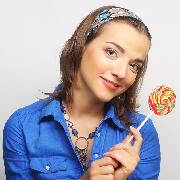 Nice young girl with lolipop