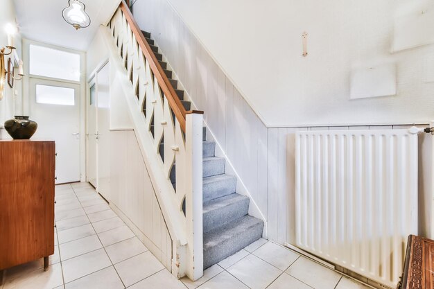 Nicely furnished entrance hall with a wooden staircase