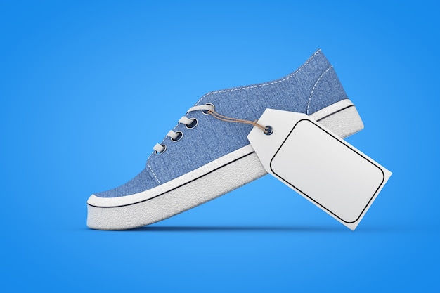 Foto nieuwe merkloze blauwe denim sneakers met witte lege mockup prijskaartje op een blauwe achtergrond. 3d-rendering