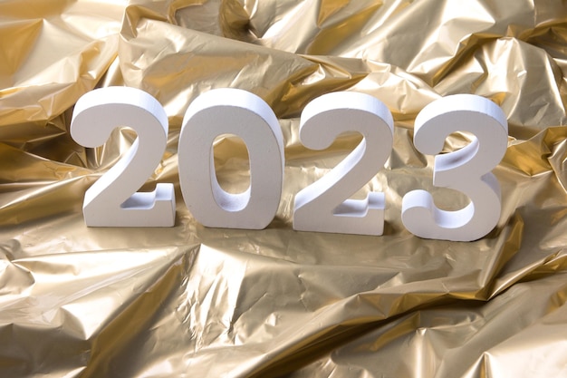 Nieuwjaar 2023 Cijfers op een gouden achtergrond