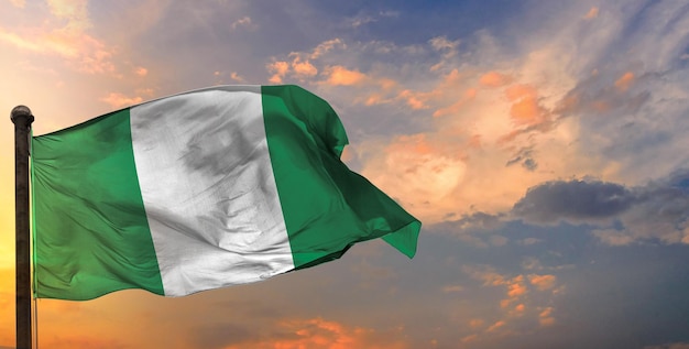 The nigeria waving flag and sky background.