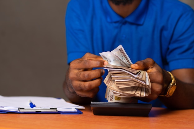 Nigerian man counting some money