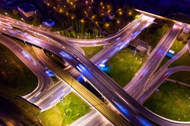 Night Aerial view of a freeway intersection traffic trails in night Moscow