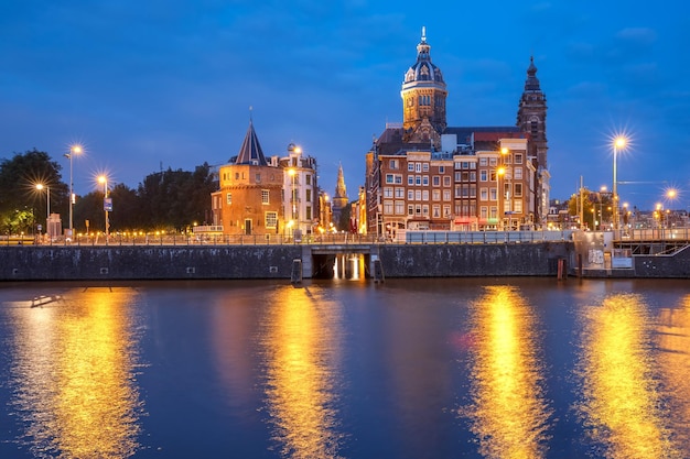 Night Amsterdam canal and Basilica Saint Nicholas