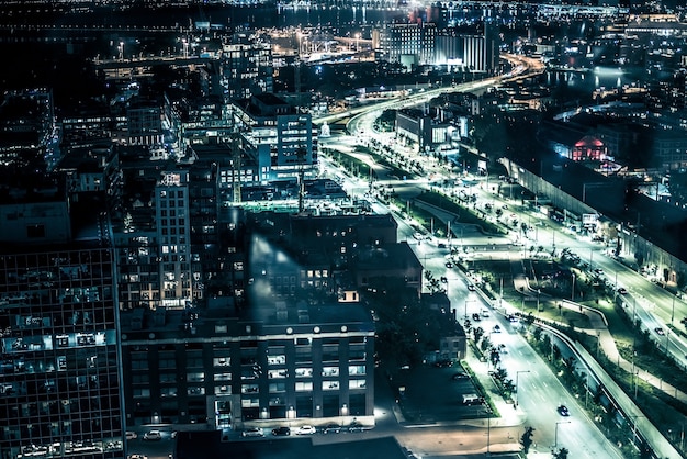 Night buildings with lights and cars at night in Montreal