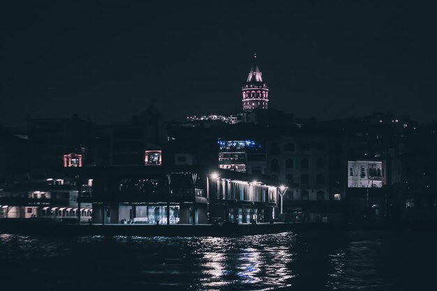 Night by sea and galata tower in karakoy