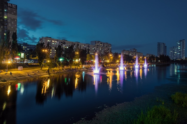 Night city landscape with a river view