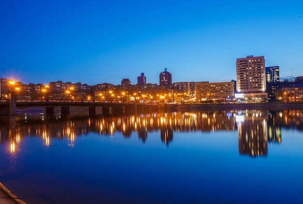 Night city reflection on the river