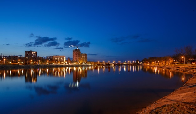 Night city reflection on the river