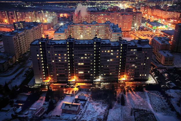 Night city top view winter, architecture top roof facade
lights