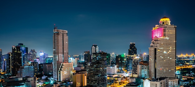 Night cityscape and high-rise buildings in metropolis city center