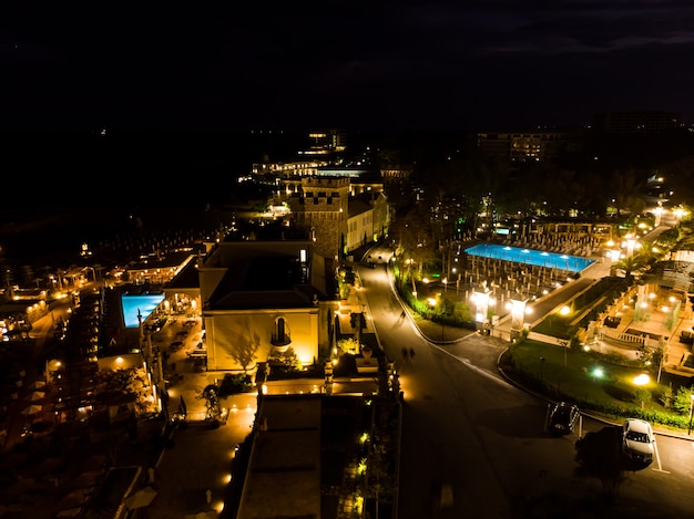 Night evening drone view of five star hotel and pool in Bulgaria, summer luxurious resort, aerial view from above