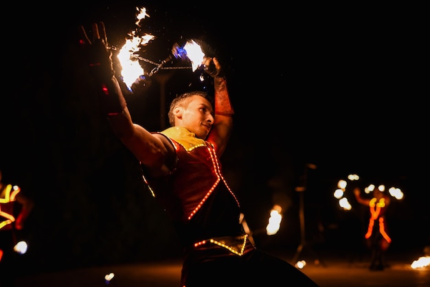 Night fiery pieces of a fire show