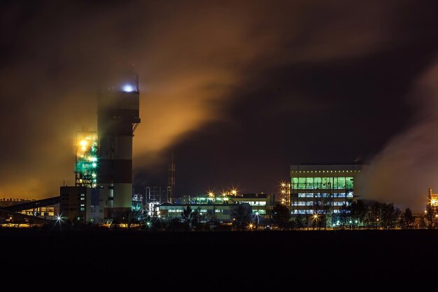 Night industrial landscape environmental pollution waste of thermal power plant Big pipes of chemical industry enterprise plant