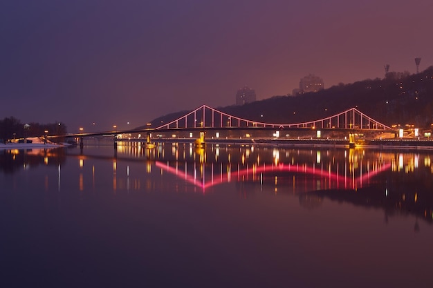 Night landscape The city of Kiev Ukraine Europe Pedestrian bridge across the Dnieper River