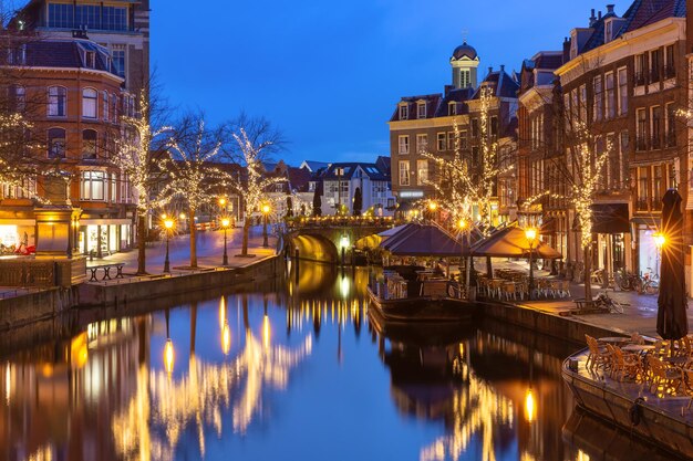 Night leiden canal oude rijn in christmas illumination south holland netherlands