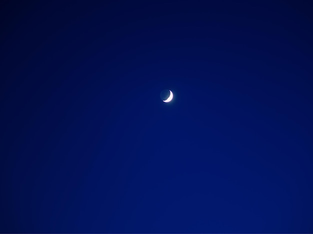 Night moon in blue sky background