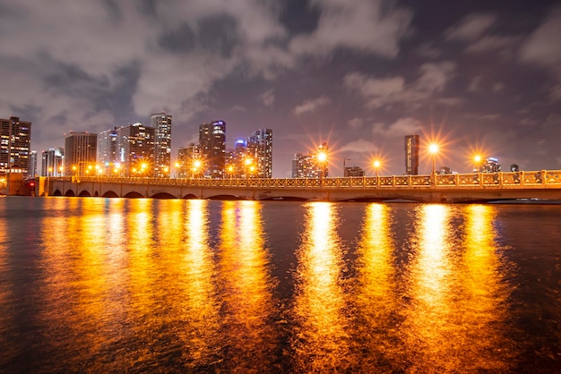 Night panoramic photo of miami landscape miami downtown behind macarthur causeway shot from venetian