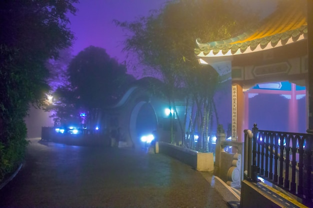 Night at the park of Hong Kong. Gazebos, fog and street lights