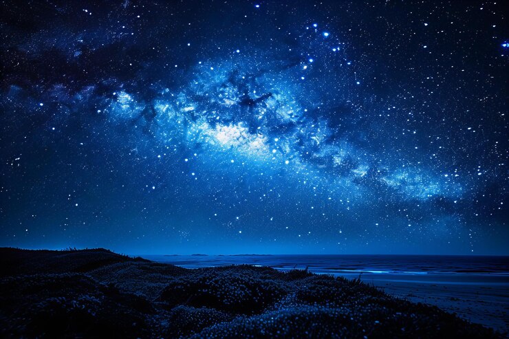 Photo 背景にビーチと海がある夜空