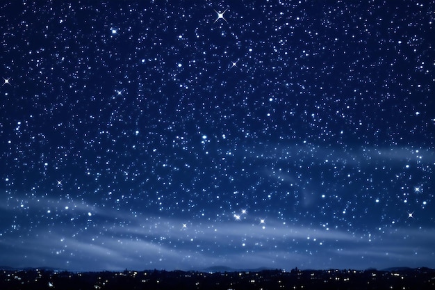 Night sky with stars and the silhouette of a city in the foreground