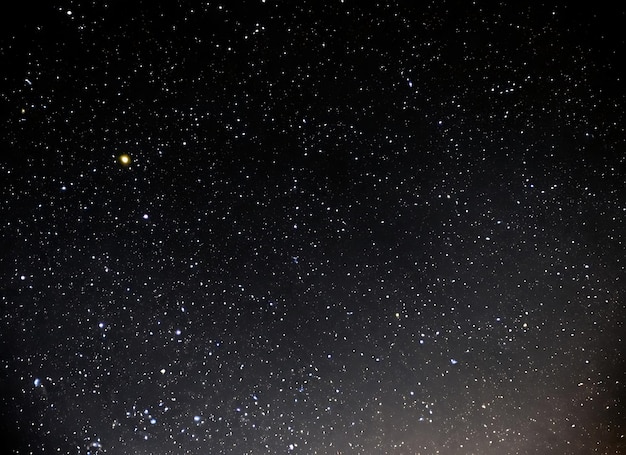 Night sky with stars sparkling on black background