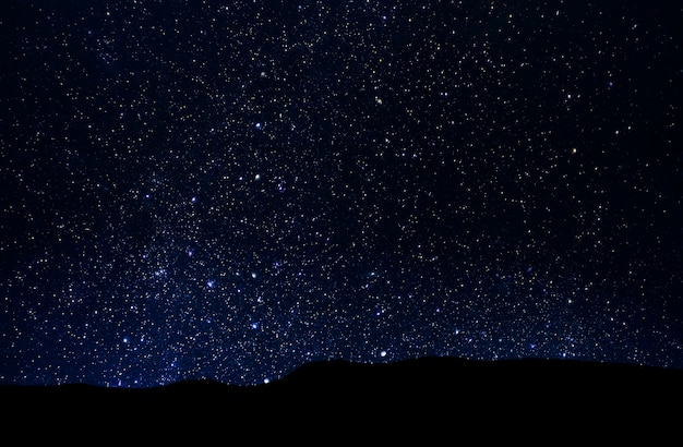 Night starry sky, deep space over valley