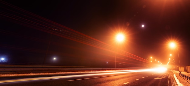 Night street on long exposure. Traces of car headlights.