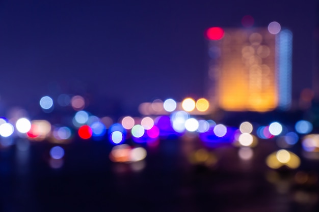 Photo night twilight blurred light bokeh in downtown bangkok abstract background.
